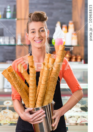 Female seller in Parlor with ice cream cone 10968835