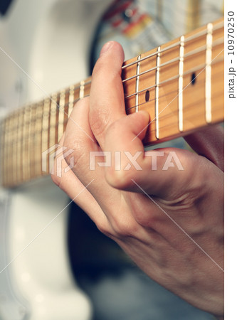 Guitarist playing an electric guitar Guitarist playing an electric guitar 10970250