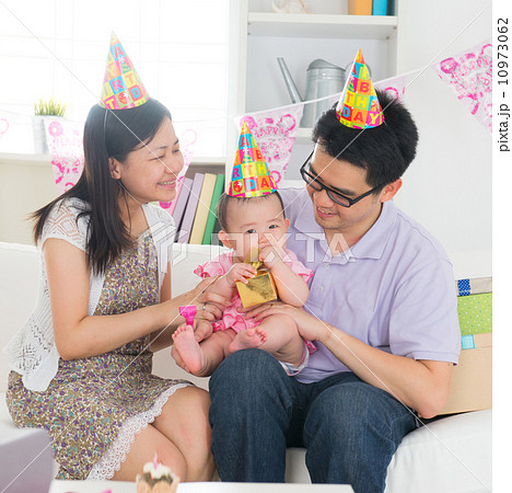 asian baby with family celebrating baby birthday party asian baby with family celebrating baby birthday party 10973062
