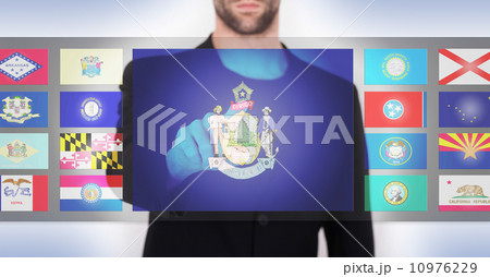 Hand pushing on a touch screen interface 10976229