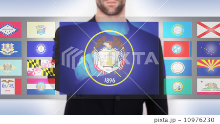 Hand pushing on a touch screen interface 10976230