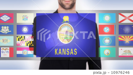 Hand pushing on a touch screen interface 10976246