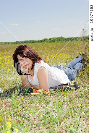 Woman resting on the grass Woman resting on the grass 10977162