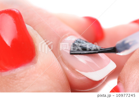 manicure, applying clear enamel 10977245