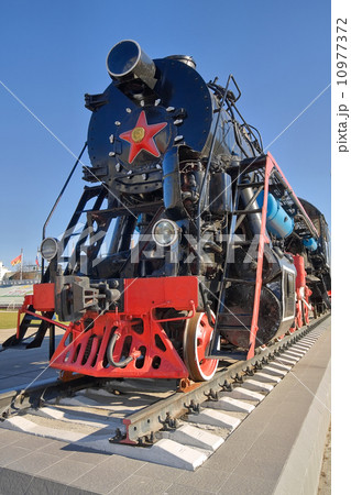 Ancient steam locomotive with red star 10977372