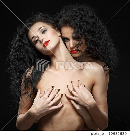 Lesbian play. Two beautiful girls in love foreplay 10982629