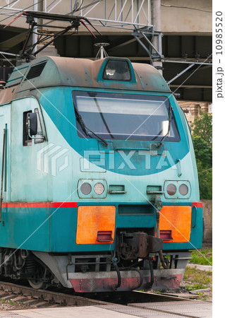 Modern green cargo train locomotive with red signs 10985520