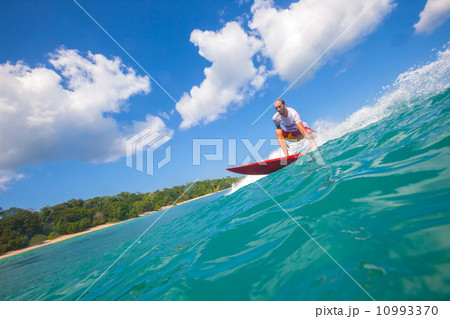 Surfing a wave. 10993370