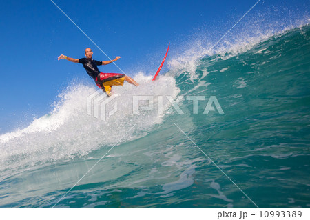 Surfing a wave. 10993389