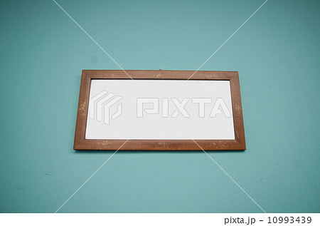 Blank wooden Photo frame on blue green background 10993439