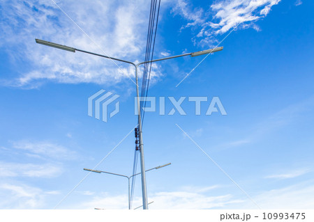 Electric lighting system tower on blue sky background Electric lighting system tower on blue sky background 10993475