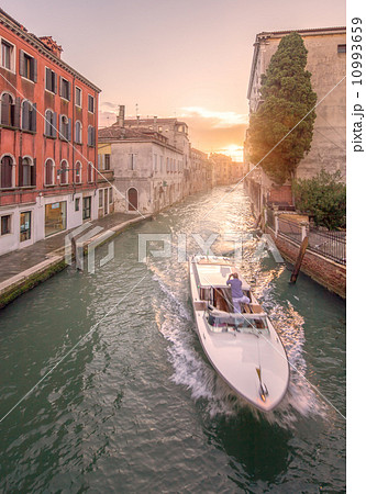Gondola with gondolier in Venice, Italy 10993659