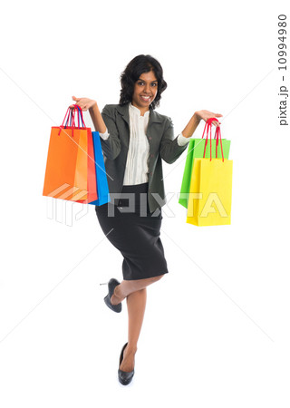 indian woman jumping in joy during shopping spree indian woman jumping in joy during shopping spree 10994980