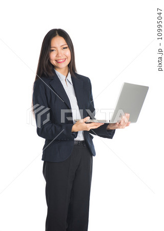 asian business woman with laptop standing with white background 10995047