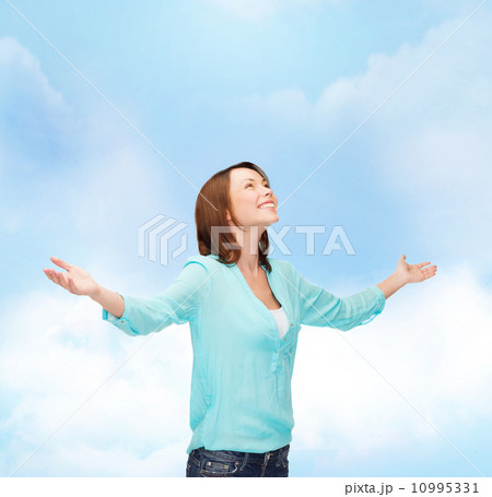 smiling woman waving hands smiling woman waving hands 10995331