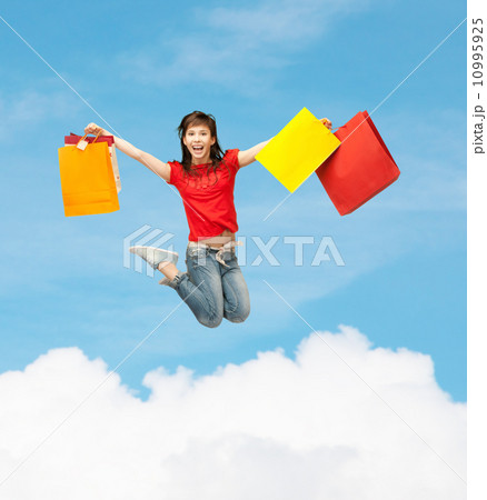 excited girl with shopping bags excited girl with shopping bags 10995925