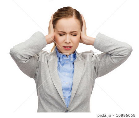 stressed businesswoman with covered ears stressed businesswoman with covered ears 10996059