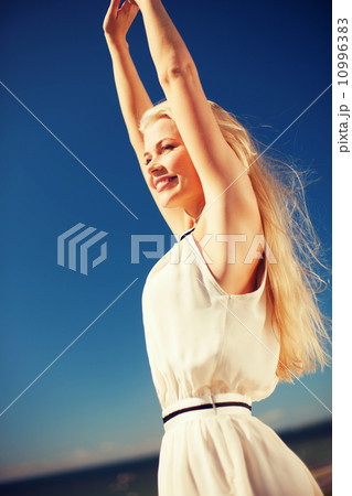 beautiful woman enjoying summer outdoors beautiful woman enjoying summer outdoors 10996383