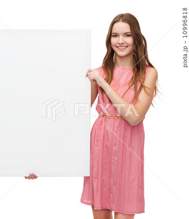 young woman in dress with white blank board young woman in dress with white blank board 10996818