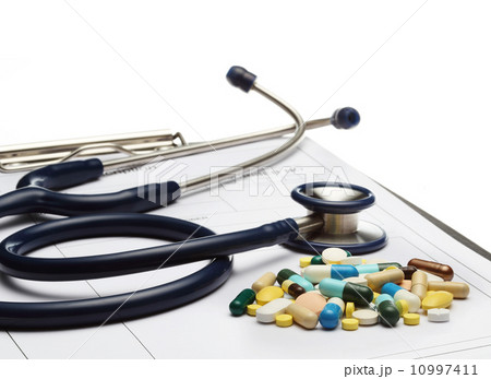 stethoscope on prescription and pills on white background 10997411