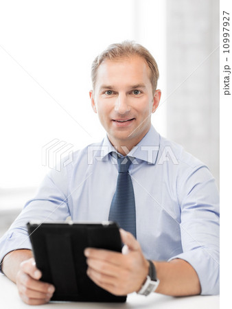 businessman with tablet pc in office 10997927