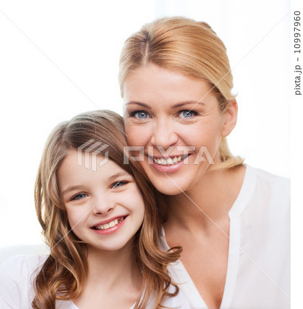 smiling mother and little girl at home smiling mother and little girl at home 10997960