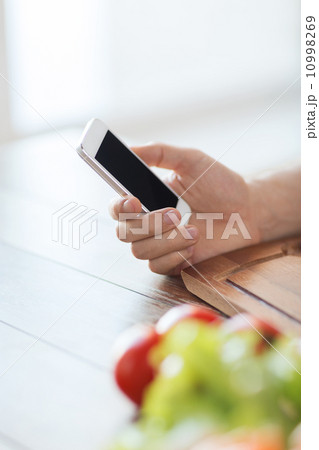 closeup of man with smartphone 10998269