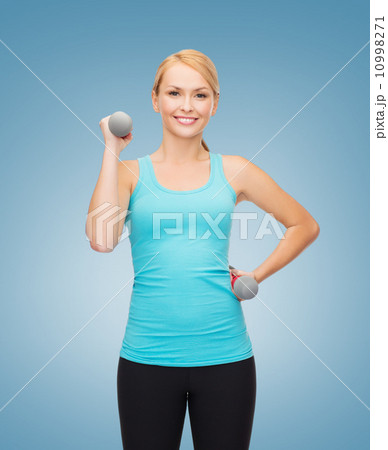 young sporty woman with light dumbbells young sporty woman with light dumbbells 10998271