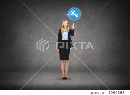 attractive young businesswoman with her finger up attractive young businesswoman with her finger up 10998684
