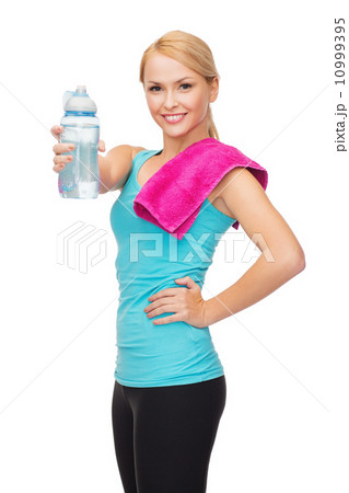 sporty woman with towel and watel bottle sporty woman with towel and watel bottle 10999395
