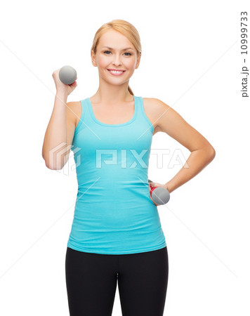 young sporty woman with light dumbbells young sporty woman with light dumbbells 10999733
