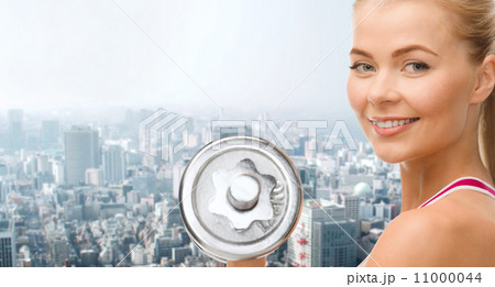 smiling woman with heavy steel dumbbell smiling woman with heavy steel dumbbell 11000044