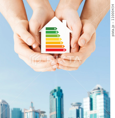 hands holding white paper house 11000434