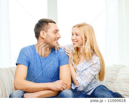 smiling happy couple at home 11000628