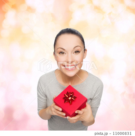 smiling asian woman with red gift box smiling asian woman with red gift box 11000831