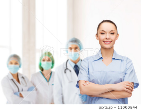 smiling female doctor or nurse smiling female doctor or nurse 11000844