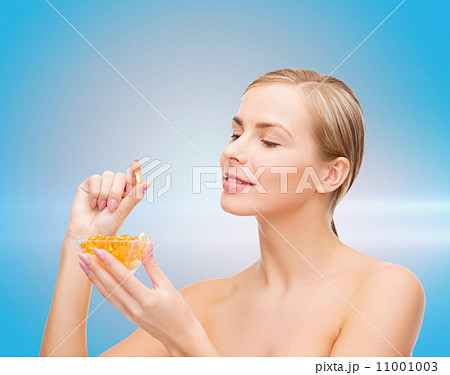lovely woman with omega 3 vitamins 11001003