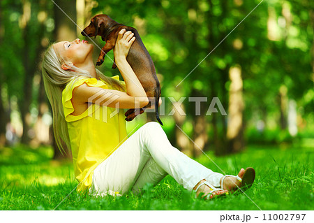 woman dachshund in her arms 11002797