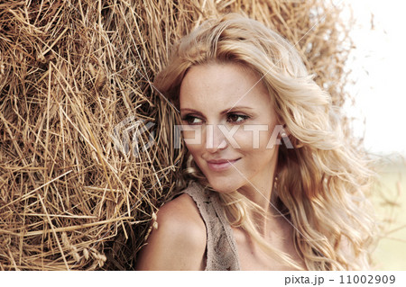 woman on hay woman on hay 11002909