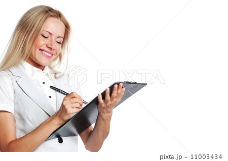 business woman writing in notebook business woman writing in notebook 11003434