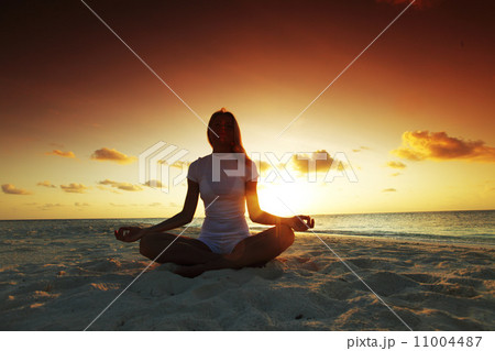 sunset yoga woman sunset yoga woman 11004487
