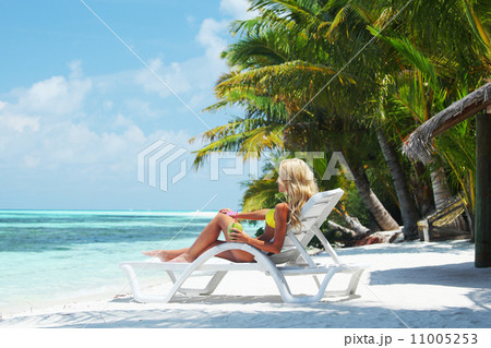 tropical woman on lounge 11005253