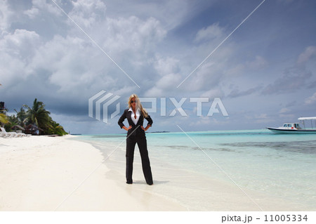 happy business woman on the ocean coast 11005334