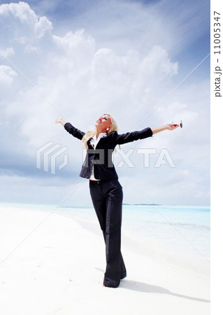 happy business woman on the ocean coast happy business woman on the ocean coast 11005347