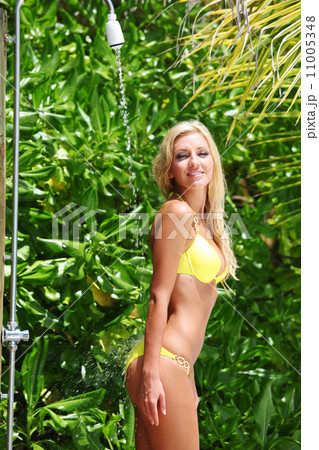 woman in tropical shower 11005348