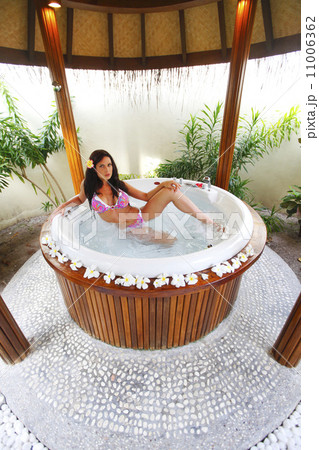 Pretty woman relaxing in jacuzzi 11006362