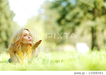 Woman lying on grass 11006561