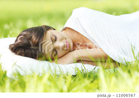 Woman sleeping on grass 11006567