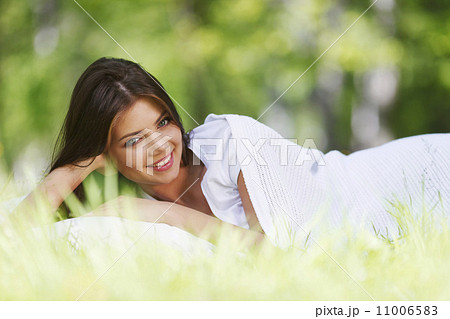Woman sleeping on grass Woman sleeping on grass 11006583
