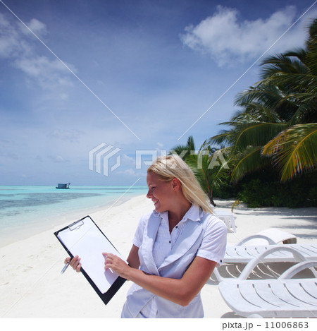 business woman with blank paper on the ocean coast 11006863